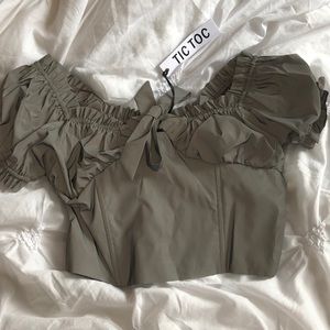 “Meant to be seen crop top” in grey